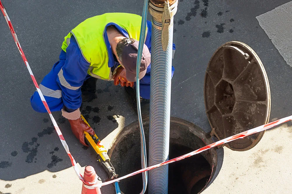Plumber checking sewer line