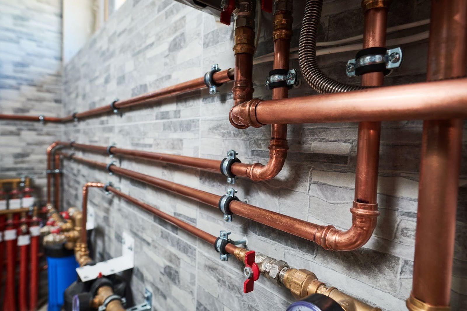 Close-up view of copper pipes and valves showcasing their intricate connections and metallic sheen